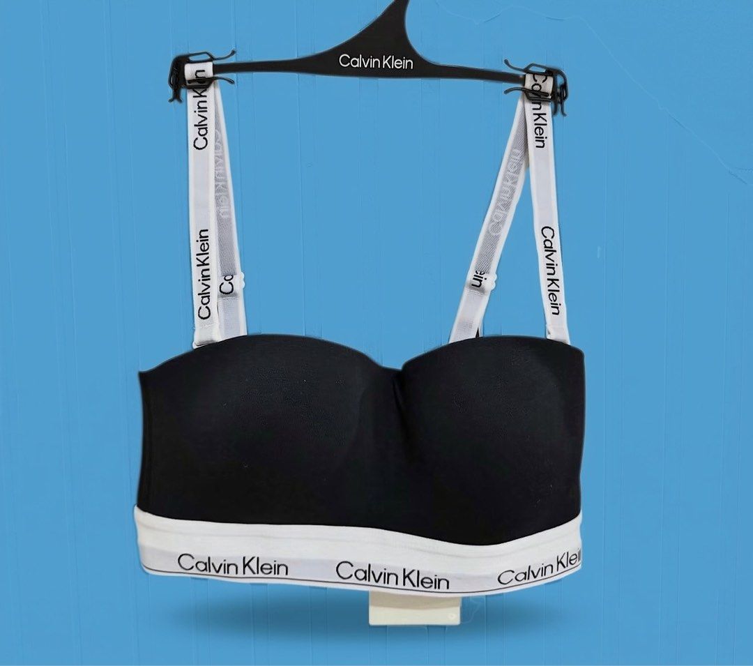Calvin Klein Lightly Lined Bandeau Bra Black Size M (Category: Undergarments & Loungewear) located in Binan City. Submitted by just4stuffs (Listing ID 1470204126, Image 1). Description: - Brand: Calvin Klein - Style: Lightly lined bandeau bra - Color: Black with white elastic underband - Size: Medium (M) - Condition: Brand new with original tags attached, never worn - Features: detachable straps.