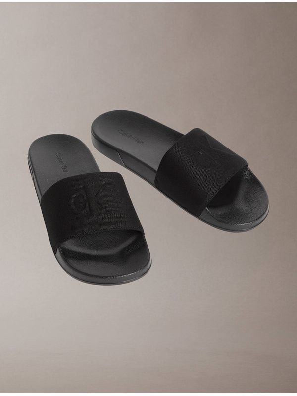 Calvin Klein Monogram Slides Black 26cm (Category: Slippers and slides) located in Santa Rosa. Submitted by miqboutique (Listing ID 1470186099, Image 2). Description: CK Monogram Slides 8US Womens(26cm) w/ paperbag ₱2,499 + SF • Ready to ship • Guaranteed Original Fb page: Miq's Boutique.