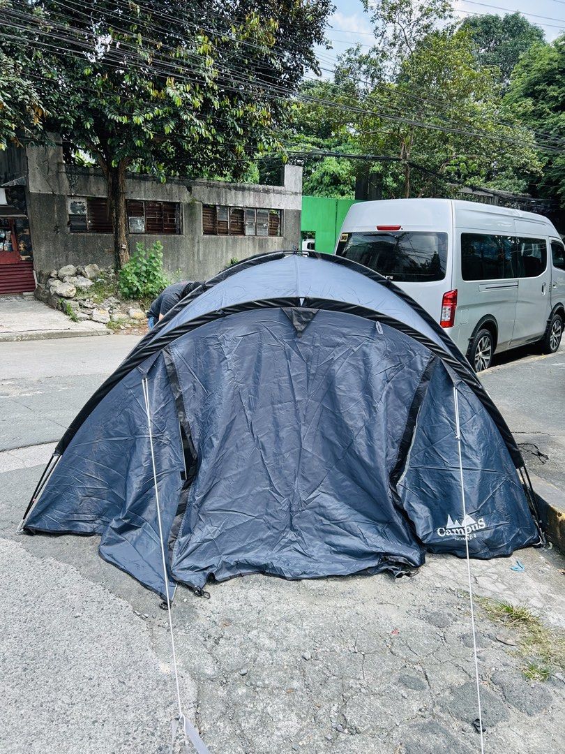 Campus Nomad 4 Grey Camping Tent (Category: Hiking & Camping) located in Manila. Submitted by starbalesukandjapansurplus (Listing ID 1470214605, Image 1). Description: - Brand/Model: Campus Nomad 4 Grey Tent - Capacity: Roomy interior fits up to 4 people - Design: Double layer with outer flysheet and attached guy lines - Condition: Used only for testing setup, material is clean and intact - Best for: Weekend camping trips and outdoor festivals - 