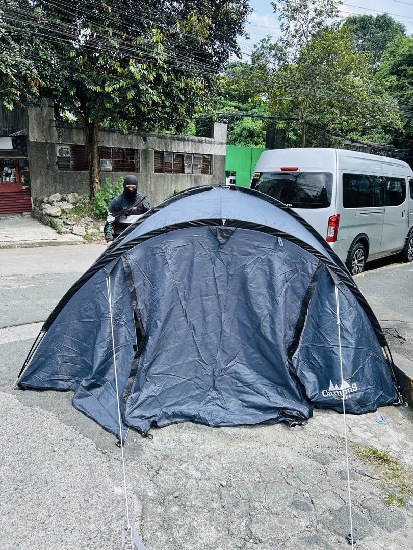Campus Nomad 4 Grey Camping Tent (Category: Hiking & Camping) located in Manila. Submitted by starbalesukandjapansurplus (Listing ID 1470214605, Image 2). Description: - Brand/Model: Campus Nomad 4 Grey Tent - Capacity: Roomy interior fits up to 4 people - Design: Double layer with outer flysheet and attached guy lines - Condition: Used only for testing setup, material is clean and intact - Best for: Weekend camping trips and outdoor festivals - 