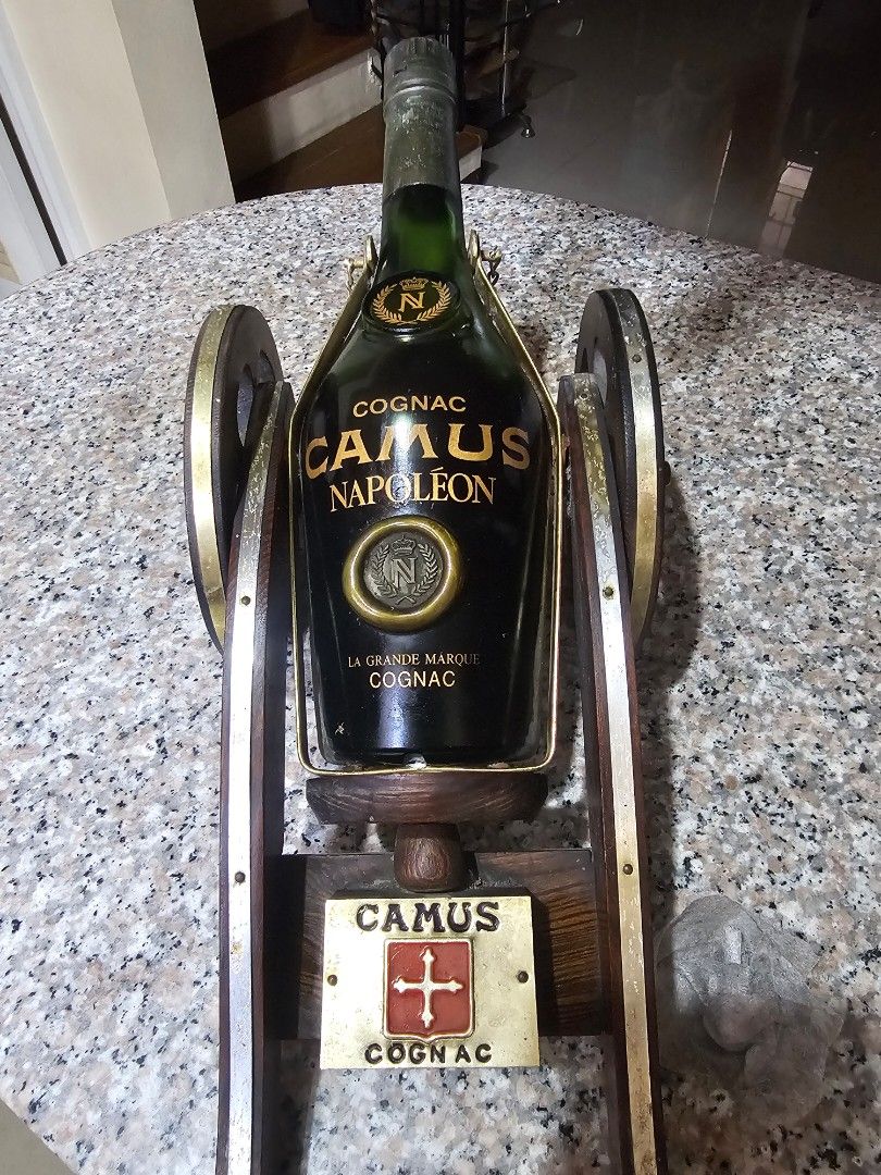 Camus Napoleon Cognac Cannon Bottle Display (Category: Vintage Collectibles) located in Marilao. Submitted by bcantong (Listing ID 1470152519, Image 1). Description: - Authentic Camus Napoleon cognac bottle shaped like a vintage cannon - Detailed with working wooden carriage wheels and metal accents - Includes original branded display plaque and glass stopper - Heavy, solid build ideal for home bars and display cabinets - Excellent collector's it