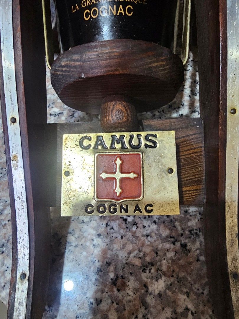 Camus Napoleon Cognac Cannon Bottle Display (Category: Vintage Collectibles) located in Marilao. Submitted by bcantong (Listing ID 1470152519, Image 2). Description: - Authentic Camus Napoleon cognac bottle shaped like a vintage cannon - Detailed with working wooden carriage wheels and metal accents - Includes original branded display plaque and glass stopper - Heavy, solid build ideal for home bars and display cabinets - Excellent collector's it