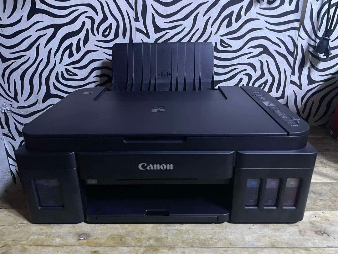 Canon G2010 - 3in1 Printer (Category: Printers, Scanners & Copiers) located in Quezon City. Submitted by yzamae (Listing ID 1470175265, Image 1). Description: Canon G2010 - 3in1 Printer 🔖 3,000 Php ✅ Print (Short, A4, Long) ✅ Photocopy (Short & A4) ✅ Scan (Short & A4) ✅ Borderless Printing ✅ Dye Ink ✅ Continuous Ink ✅ Complete Nozzle Test all you want! ✅ Pick up and/or lalamove..
