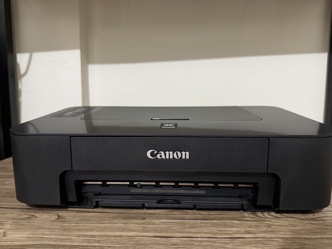 Canon PIXMA TS207 Inkjet Printer (Category: Printers, Scanners & Copiers) located in Lopez. Submitted by lohrchie (Listing ID 1470253443, Image 1). Description: - Model: Canon PIXMA TS207 Inkjet Printer - Color: Sleek black with a compact, space-saving design - Features: Top paper tray and front output slot with easy top-left control panel - Condition: Powers up and works great - Ideal Use: Perfect for basic home or dorm printing needs - Meetup o