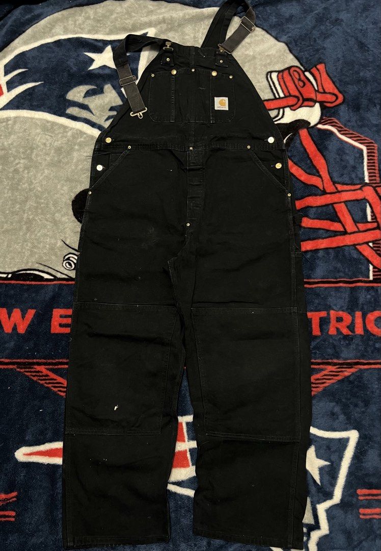 Carhartt Black Double Knee Work Overalls (Category: Jeans) located in Tanza. Submitted by 1954_street (Listing ID 1470306567, Image 1). Description: CARHARTT OVERALL 42 waist 41 length (waist to hem) 10 leg opeing minor tattered parts, minor paint stain but still in crispy condition 3000 - Color: Black - Material: Heavy-duty duck canvas - Design: Double knee reinforcement for durability - Storage: Multiple utility pockets on chest, legs, and back