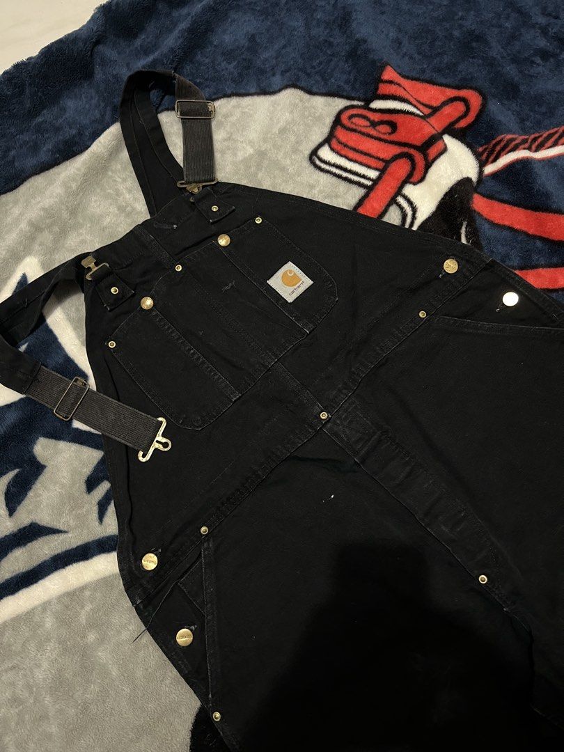 Carhartt Black Double Knee Work Overalls (Category: Jeans) located in Tanza. Submitted by 1954_street (Listing ID 1470306567, Image 2). Description: CARHARTT OVERALL 42 waist 41 length (waist to hem) 10 leg opeing minor tattered parts, minor paint stain but still in crispy condition 3000 - Color: Black - Material: Heavy-duty duck canvas - Design: Double knee reinforcement for durability - Storage: Multiple utility pockets on chest, legs, and back