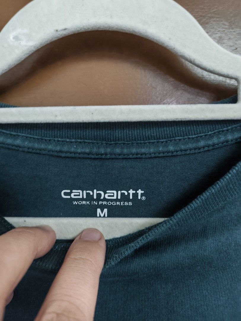 Carhartt WIP Coin Shirt (Category: Tshirts & Polo Shirts ) located in San Pedro. Submitted by madvillainkicks (Listing ID 1470153389, Image 2). Description: Carhartt WIP graphic tee in dark teal green, size medium. Features a collegiate logo and 100% cotton build. DM to order! 24 x 28.