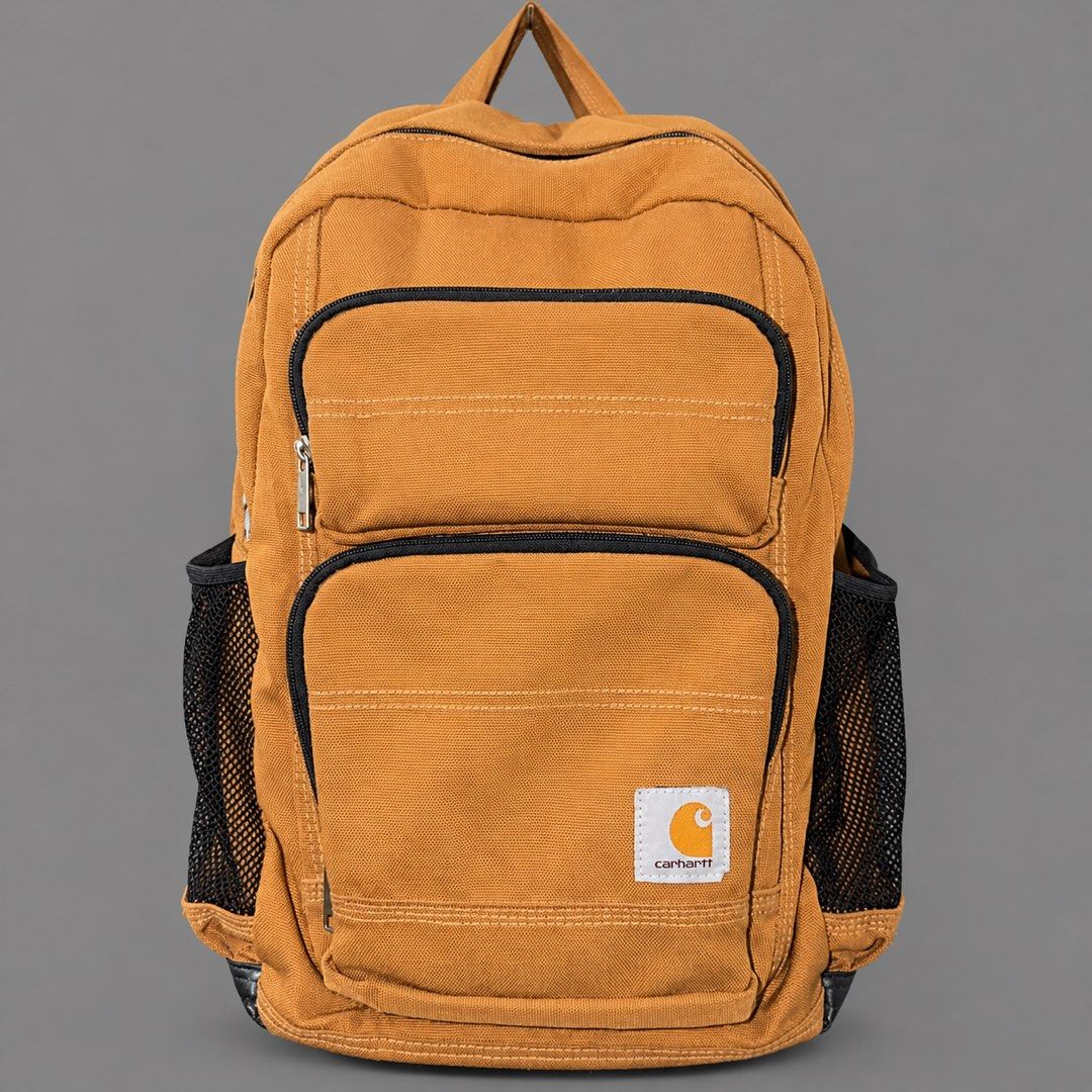 Carht Brown Canvas Backpack with Multiple Pockets (Category: Backpacks) located in Santa Rosa. Submitted by n.vallermosa (Listing ID 1470195908, Image 1). Description: Carhartt Legacy BRN Backpack Condition 8.5/10 Color rate 9/10 Issues : signs of usage Price 2500 - Brand/Style: Authentic Carhartt classic workwear style in durable brown canvas - Storage: Large main compartment with an interior laptop sleeve and divider - Front Pockets: Two zipper