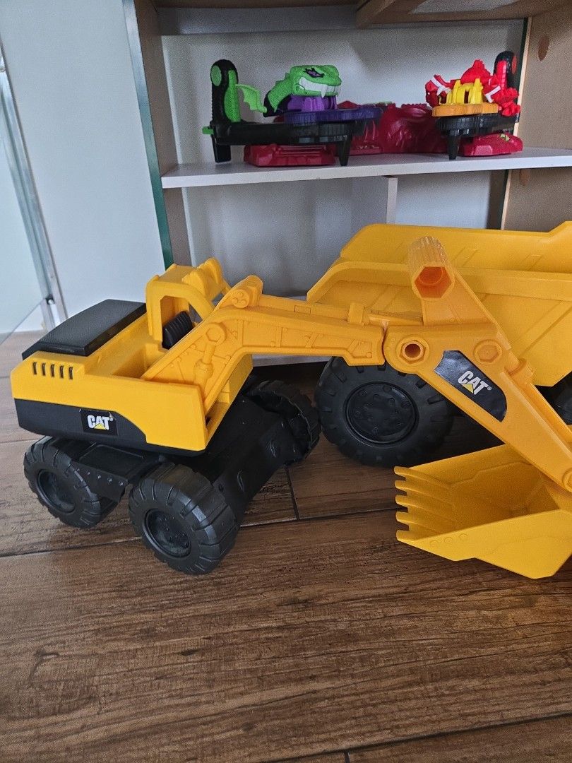 CAT Construction Toy Set Dump Truck Excavator Loader (Category: Kids Toys) located in Pasig City. Submitted by izzy0202 (Listing ID 1470146128, Image 2). Description: - Set of 3 authentic CAT construction toys: large dump truck, front loader, and small dump truck - Features real working parts and durable, chunky rubber wheels - Rugged Caterpillar build quality designed for heavy-duty play - Versatile for both indoor and outdoor sandbox adventures