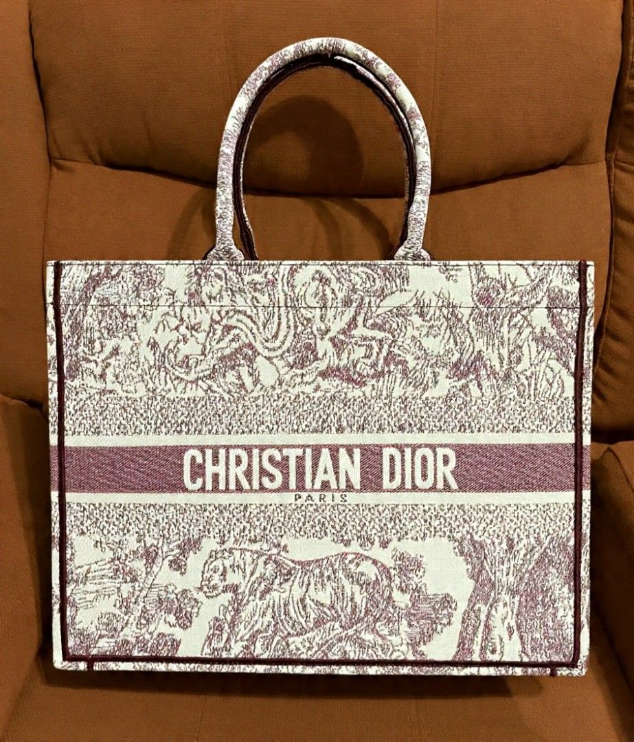 CD Large Book Tote (Category: Shoulder Bags) located in Quezon City. Submitted by luxxechic (Listing ID 1470296255, Image 1). Description: coded embroidered limited edition with pouch good as new no issue japan preloved actual photo posted mop: gcash.