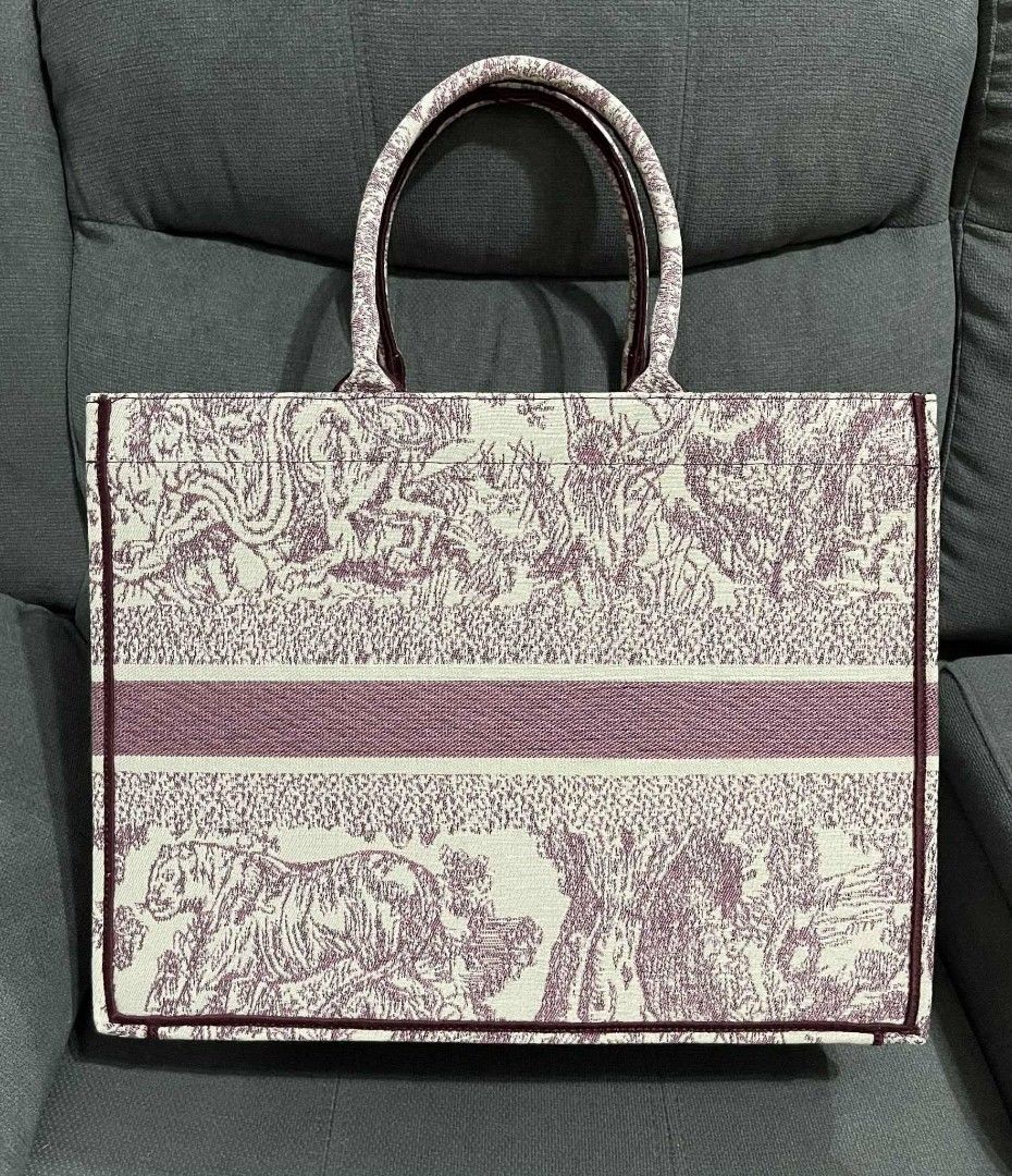 CD Large Book Tote (Category: Shoulder Bags) located in Quezon City. Submitted by luxxechic (Listing ID 1470296255, Image 3). Description: coded embroidered limited edition with pouch good as new no issue japan preloved actual photo posted mop: gcash.
