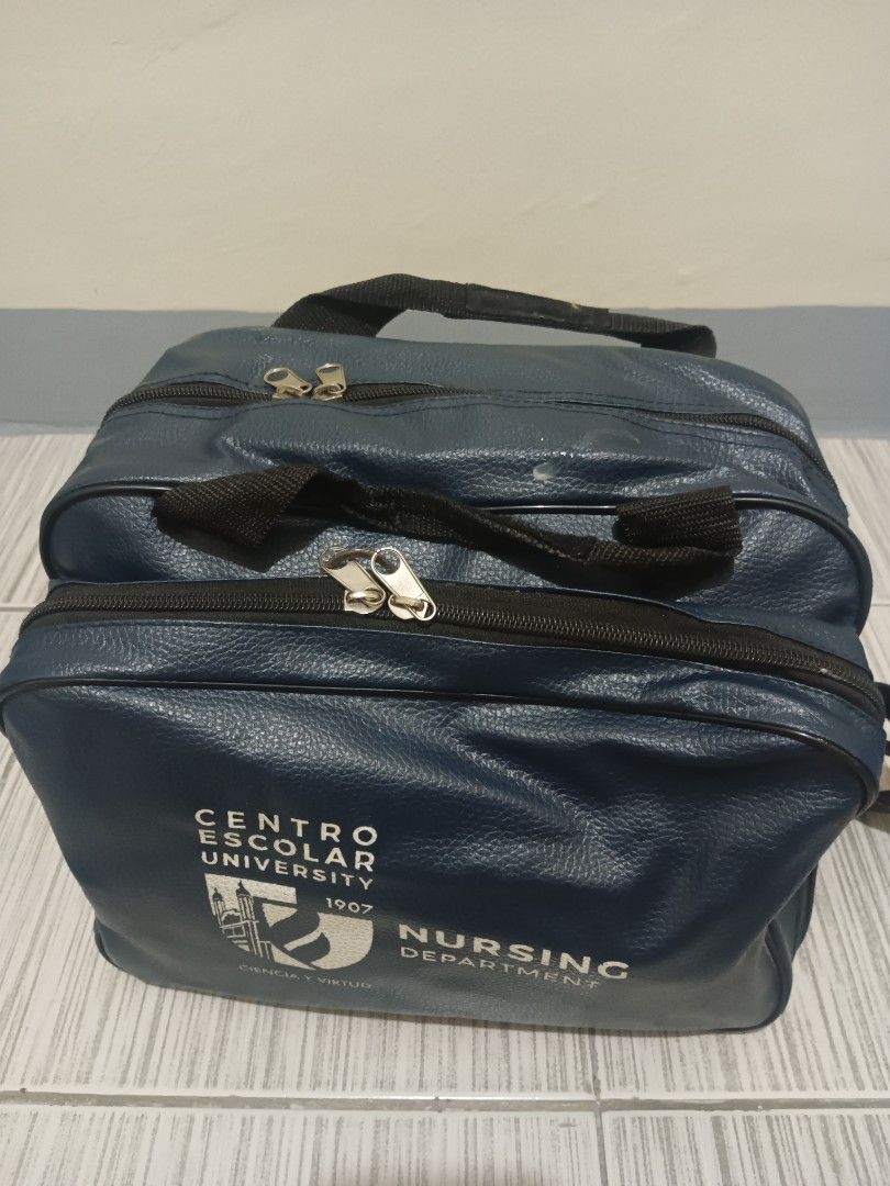 Centro Escolar University Nursing Department Bag (Category: Nursing & Healthcare) located in Mandaluyong City. Submitted by renewes (Listing ID 1470246983, Image 1). Description: - Authentic Centro Escolar University (CEU) Nursing Department blue leatherette bag - Features multiple zippered compartments and handy inner organizers - Comes with top handles and a convenient shoulder strap - Includes starter nursing tools: stethoscope, reflex hammer,