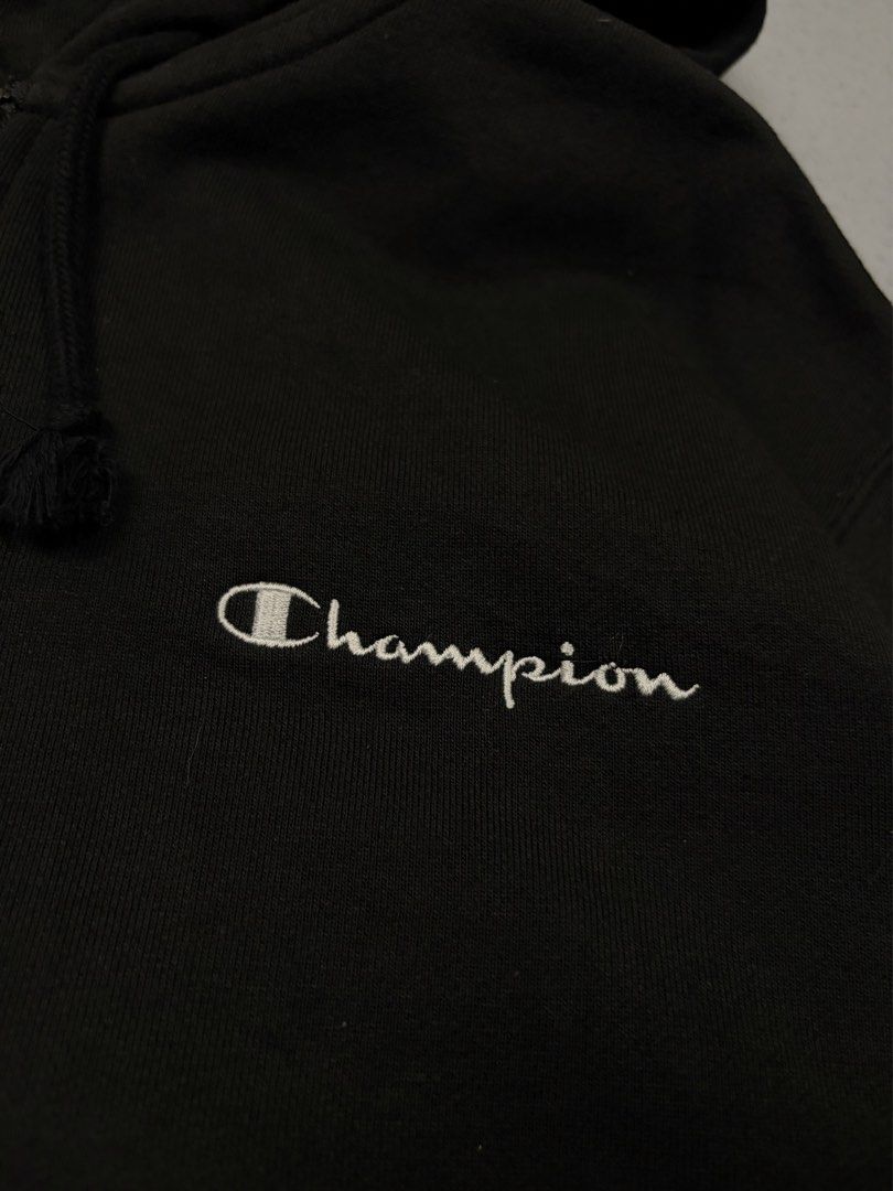 Champion Black Zip-Up Hoodie (Category: Hoodies) located in Cainta. Submitted by rizalthriftstuff (Listing ID 1470327113, Image 3). Description: Champ Zipped Jacket Dimes Size: S Width: 20 Length: 24 Color Rate: 10 Condition: 9 No Issue Mine - ₱400 - Brand: Champion - Style: Zip-up hoodie with drawstring - Color: Black with white embroidered script logo on chest - Size: Small - Details: Classic embroidered 'C' patch on left sleeve, secure front p