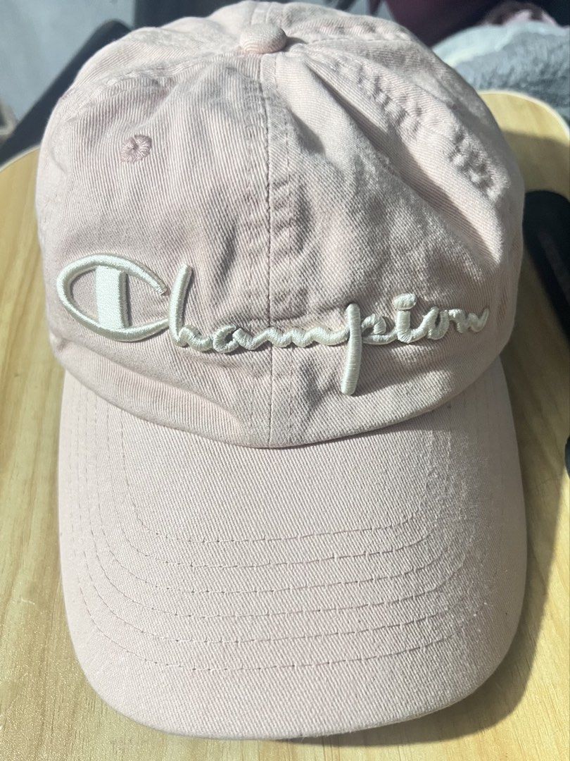Champion Pink Cap (Category: Caps & Hats) located in Pasig City. Submitted by evermourn777 (Listing ID 1470280247, Image 2). Description: - Authentic light pink Champion baseball cap - Classic white embroidered logo on the front - 100% cotton material, size 58 cm - Adjustable metal buckle strap with stamped Champion logo - Clean interior sweatband and tidy stitching throughout .