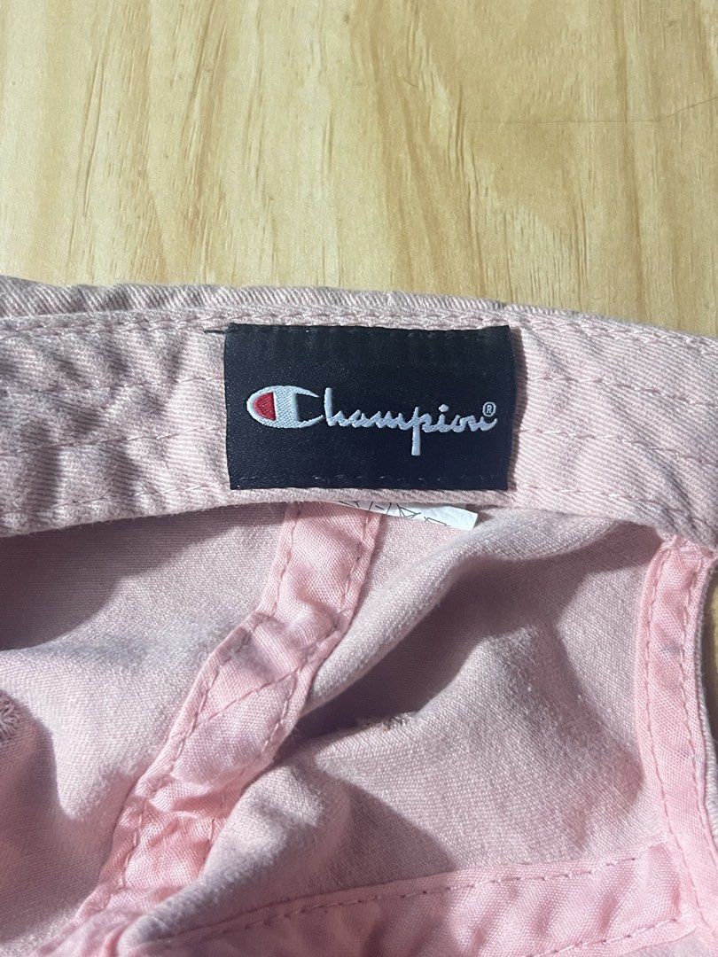 Champion Pink Cap (Category: Caps & Hats) located in Pasig City. Submitted by evermourn777 (Listing ID 1470280247, Image 3). Description: - Authentic light pink Champion baseball cap - Classic white embroidered logo on the front - 100% cotton material, size 58 cm - Adjustable metal buckle strap with stamped Champion logo - Clean interior sweatband and tidy stitching throughout .