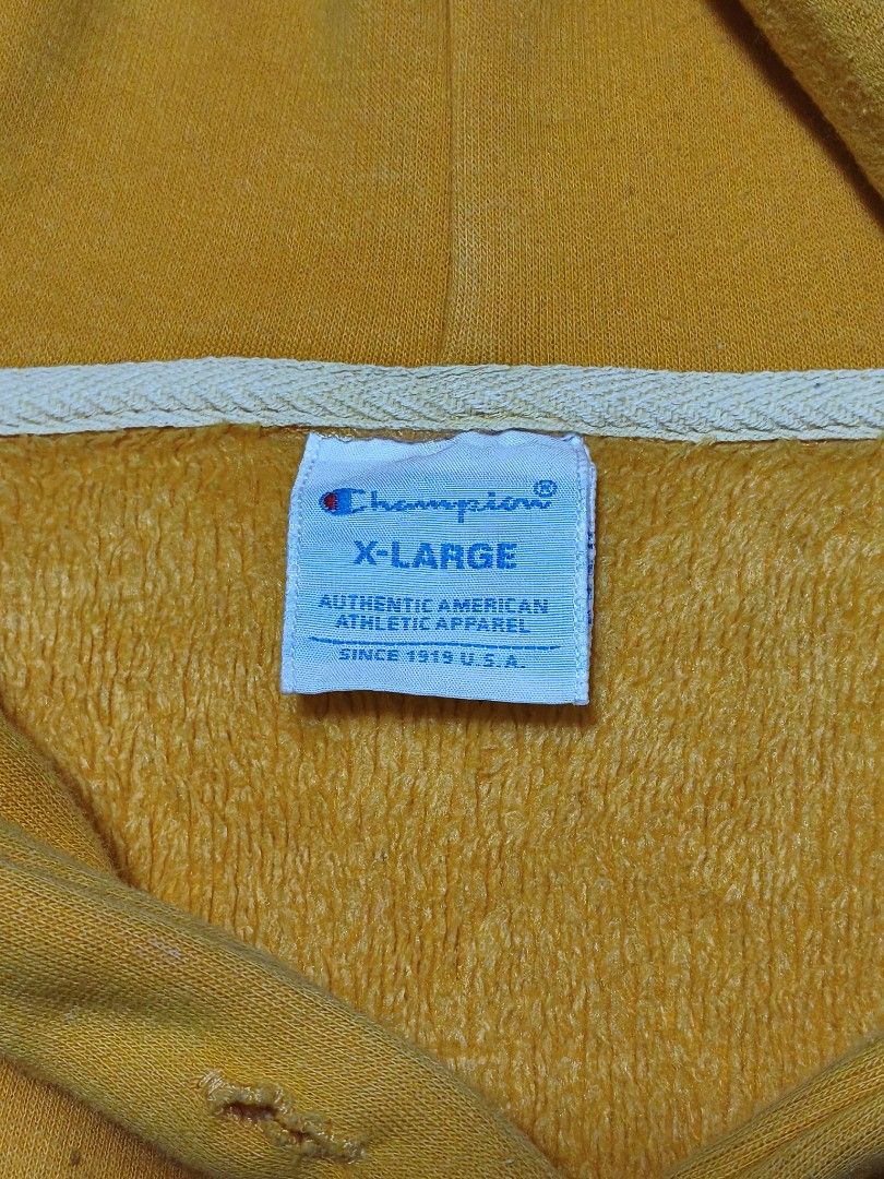 Champion Yellow Hoodie X-Large (Category: Hoodies) located in Bayambang. Submitted by rajuergui76226 (Listing ID 1470322142, Image 2). Description: - Brand: Champion - Color: Bright Yellow with Classic Script Logo - Size: Tagged XL (Fits like Men's Medium or Women's Oversized) - Dimensions: 22" x 27" - Features: Front kangaroo pocket - Condition: 9/10 color rate, solid overall - Flaws: Minor hair-lines, minimal stain, and light signs of use on ri