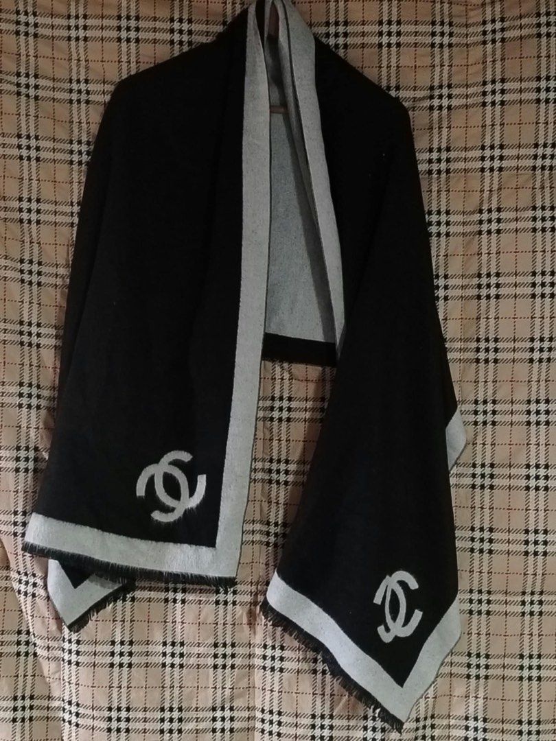 Chanel Black and Grey Logo Scarf (Category: Scarves) located in Butuan. Submitted by natalday (Listing ID 1470166048, Image 2). Description: - Authentic black and grey reversible wool scarf - Features large interlocking CC logo embroidered near each fringed end - Wide contrasting border trim design - Soft and cozy fabric texture to keep you warm during cold days - Versatile neutral colors that easily match most winter coats - Condition: Brand new