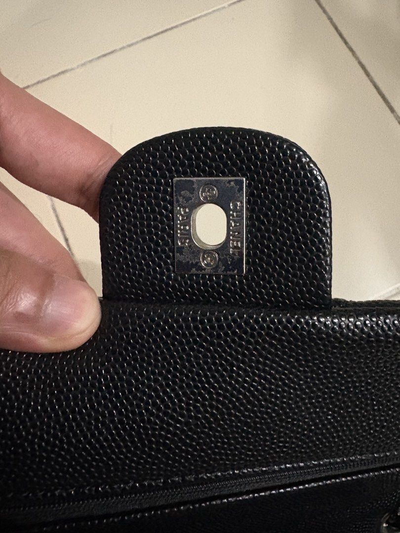 Chanel Black Caviar Leather Double Flap Bag (Category: Luxury Bags & Wallets) located in Manila. Submitted by happy.kira20 (Listing ID 1470177450, Image 2). Description: - Prelovee Chanel Classic Double Flap Handbag - Material: Black quilted caviar leather with burgundy interior lining - Hardware: Silver-tone with iconic interlocking CC turn-lock closure - Strap: Interwoven chain and leather shoulder strap - Interior: Multiple compartments with a