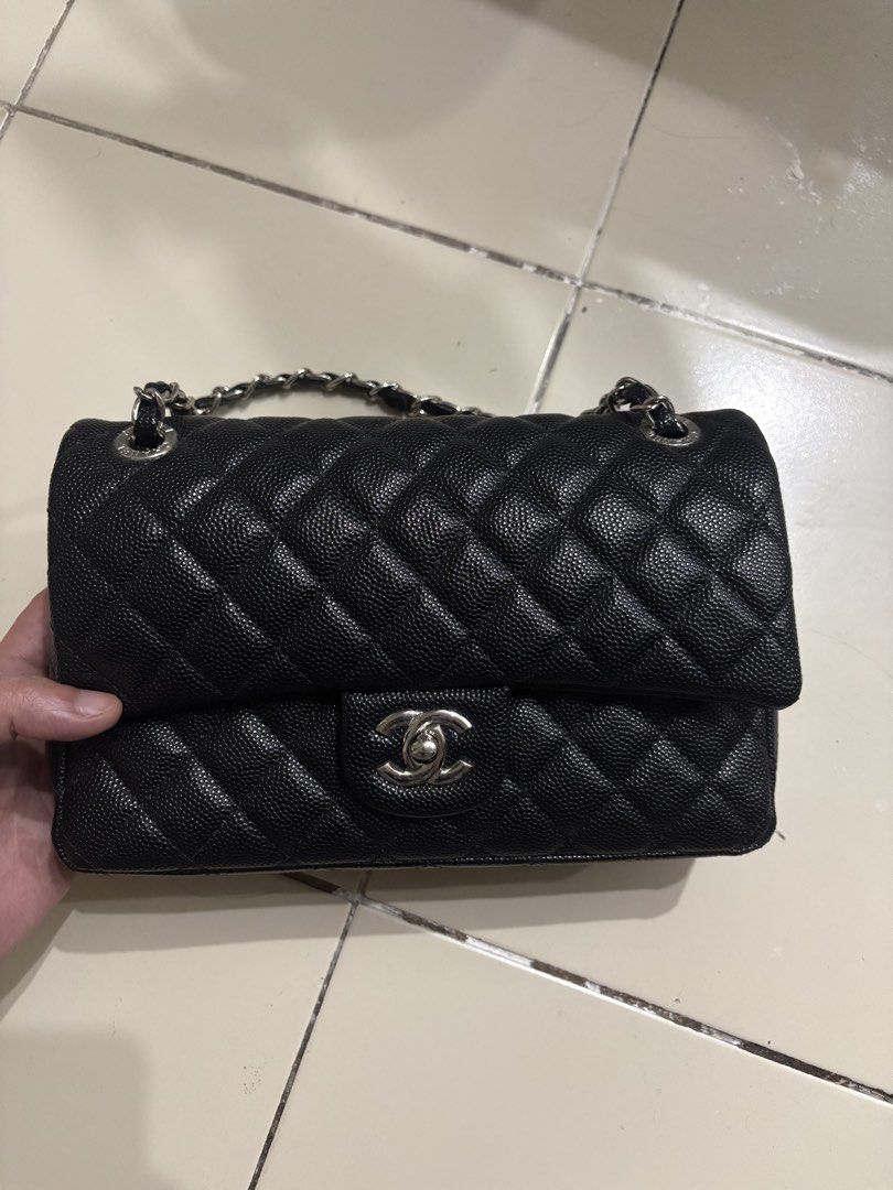 Chanel Black Caviar Leather Double Flap Bag (Category: Luxury Bags & Wallets) located in Manila. Submitted by happy.kira20 (Listing ID 1470177450, Image 1). Description: - Prelovee Chanel Classic Double Flap Handbag - Material: Black quilted caviar leather with burgundy interior lining - Hardware: Silver-tone with iconic interlocking CC turn-lock closure - Strap: Interwoven chain and leather shoulder strap - Interior: Multiple compartments with a