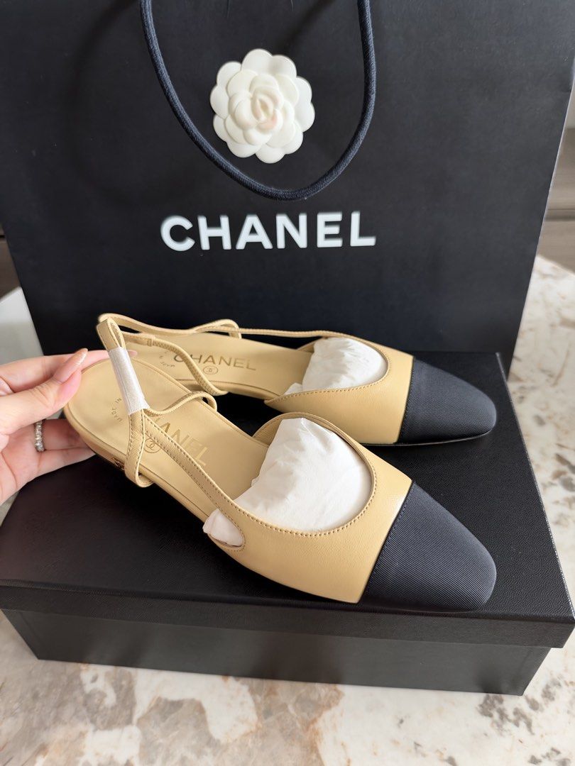 Chanel classic Slingback flats (Category: Heels) located in Manila. Submitted by luxuryelle88 (Listing ID 1470246982, Image 1). Description: PM FOR MORE DETAILS Size 38 - Authentic Chanel slingbacks in classic beige leather and black fabric - Low heel design with adjustable buckle ankle strap for all-day comfort - Comes with the original black Chanel shoebox - Includes matching Chanel paper shopping bag decorated with the iconic white camellia fl