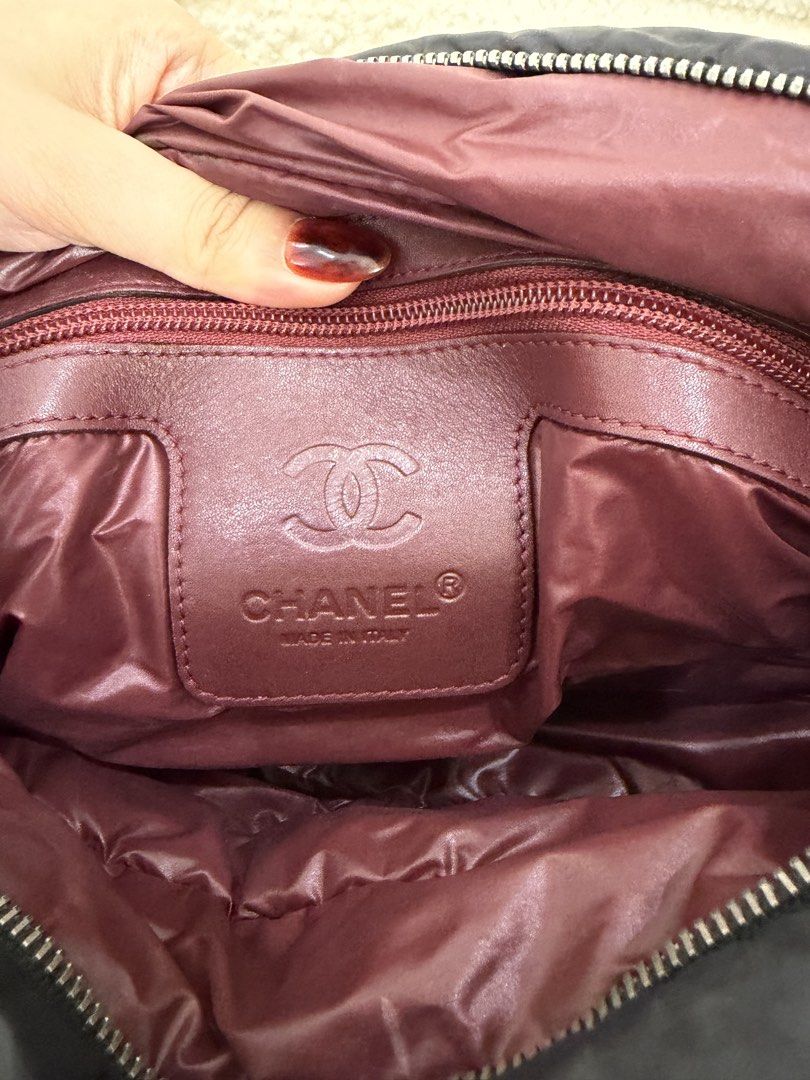 Authentic Chanel Coco Cocoon Puffer Tote Handbag Black (Category: Tote Bags) located in Adams. Submitted by luxcollects (Listing ID 1470191922, Image 2). Description: Chanel Coco Cocoon Quilted Puffer Tote in Black 🖤 An iconic archival Chanel piece from the Karl Lagerfeld era, featuring the signature oversized puffer silhouette from the house’s Coco Cocoon collection, first introduced in 2009. Crafted from lightweight, quilted black nylon with p