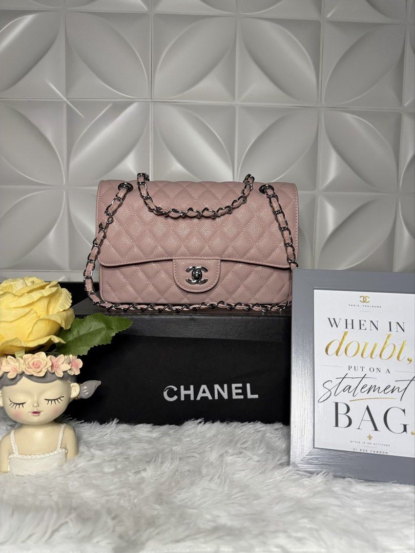 Chanel Pink Quilted Flap Bag with Chain Strap (Category: Luxury Bags & Wallets) located in Bulacan. Submitted by the_chanel-hermes__enthusiast (Listing ID 1470308456, Image 1). Description: - Color: Pale pink with matching silver hardware - Material: Classic diamond-quilted leather - Closure: Signature CC turn-lock - Strap: Silver chain strap - Shape: Structured rectangular - Condition: Clean exterior and hardware - Inclusion: Comes with black Ch