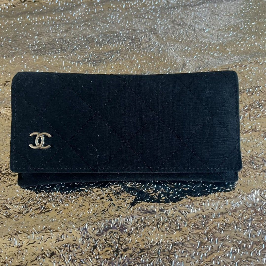 Chanel Quilted Black Fabric Eyewear Case Only (Category: Luxury Accessories) located in Manila. Submitted by almighthrift (Listing ID 1470348969, Image 1). Description: Chanel - Style: Diamond-quilted glasses case in classic black fabric - Hardware: Silver-tone interlocking CC logo on front flap - Interior: Lined in black fabric with embossed CHANEL lettering - Closure: Secure magnetic snap closure - Inclusion: Matching black fabric cleaning clot