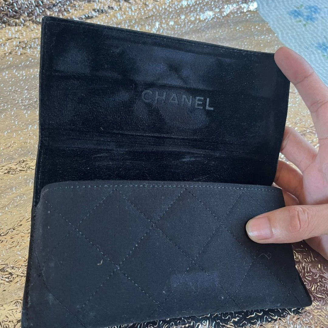 Chanel Quilted Black Fabric Eyewear Case Only (Category: Luxury Accessories) located in Manila. Submitted by almighthrift (Listing ID 1470348969, Image 2). Description: Chanel - Style: Diamond-quilted glasses case in classic black fabric - Hardware: Silver-tone interlocking CC logo on front flap - Interior: Lined in black fabric with embossed CHANEL lettering - Closure: Secure magnetic snap closure - Inclusion: Matching black fabric cleaning clot