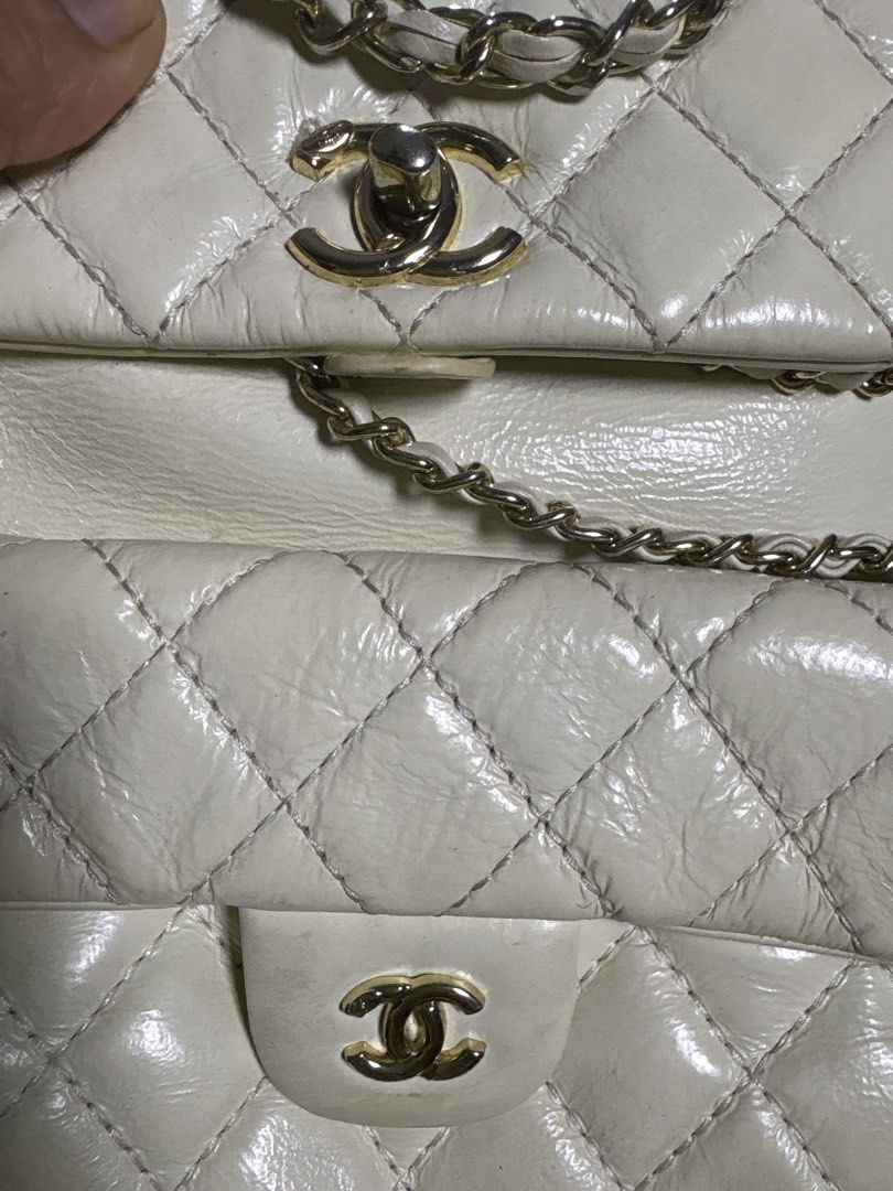 Chanel White Quilted Leather Backpack with Chain Straps (Category: Backpacks) located in Cordova. Submitted by cb_bagz_n_bloom (Listing ID 1470309676, Image 2). Description: white quilted leather Chanel backpack with gold-tone hardware and classic turn-lock closures. Features a structured design, diamond quilting, and interwoven leather and chain straps. Clean and elegant..