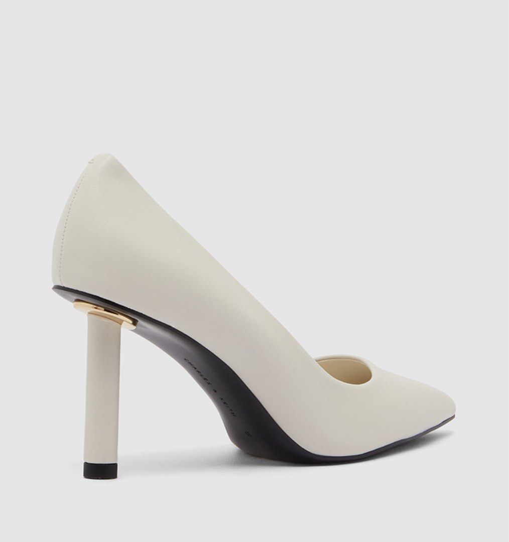 Charles & Keith: Chalk Elegant Pointed Heels with Gold Accent (Category: Heels) located in Paranaque City. Submitted by floramese (Listing ID 1470337042, Image 1). Description: Used a few times, but I have to stop gaslighting myself that it’s my size when it’s too big talaga 😆 Original price is around 3k. ✿ SO chic! would keep sana ): ✿ minor scratch only, almost good as new ✿ perfect for all occasions ✿ white/cream color.