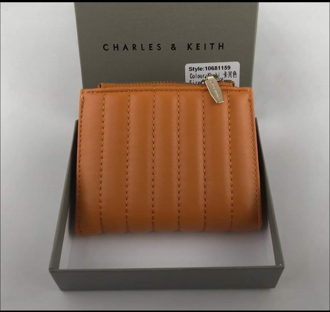 Charles & Keith Quilted Wallet Khaki (Category: Wallets & Card holders) located in Manila. Submitted by manilynpitero (Listing ID 1470143796, Image 3). Description: - Authentic Charles & Keith quilted wallet - Color: Sophisticated Khaki - Style Number: 10681159 - Size: XXS (Compact fold-over design) - Secure snap button closure - Convenient zippered coin compartment on top - Multiple card slots inside for your essentials.