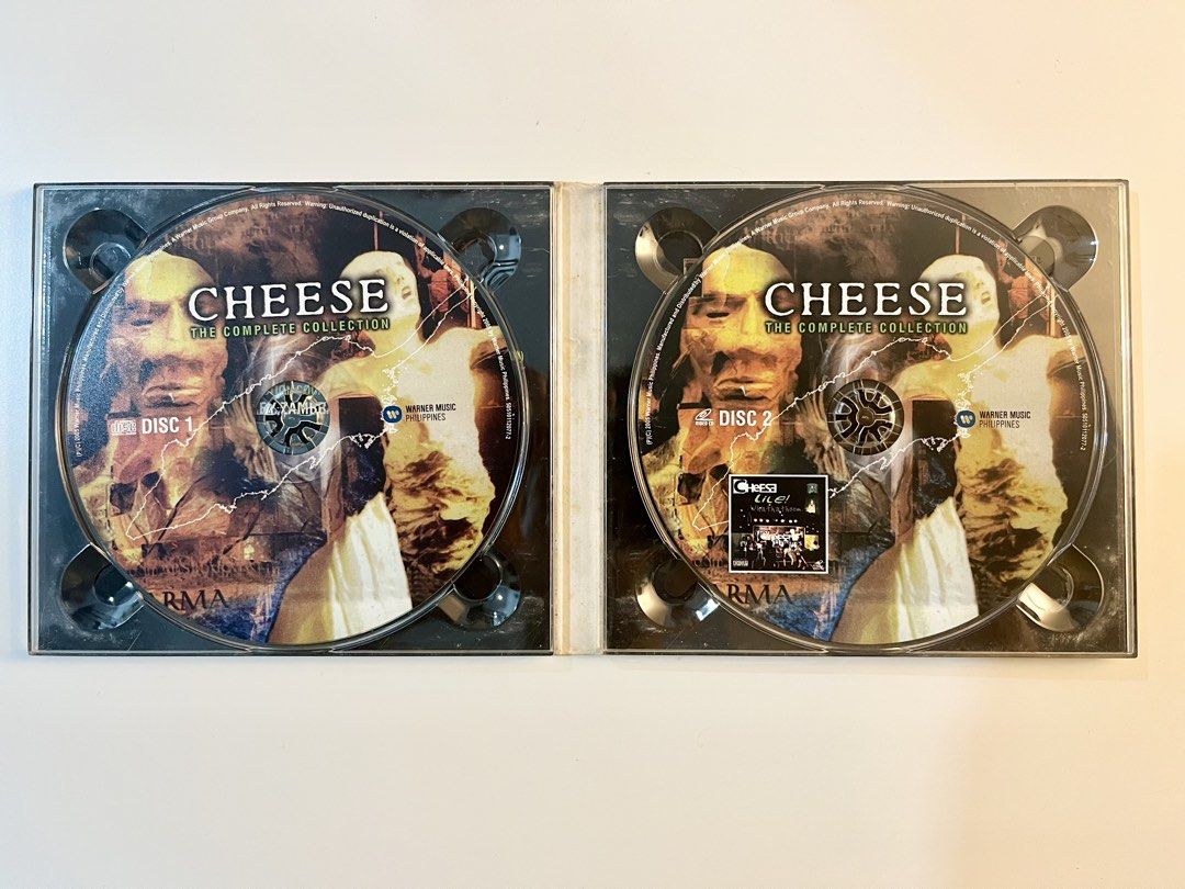 Cheese - The Complete Collection 2-Disc CD & Video CD Set (OPM) (Category: CDs & DVDs) located in Calamba. Submitted by mabcollectibles (Listing ID 1470344948, Image 3). Description: - Official Warner Music Philippines double disc release - Disc 1: 20 tracks including Trilogy, 10X Karma, and Guinea Pig - Disc 2: Video CD featuring Parusa, Enes, Steve, and more - Discs are clean - Hard-to-find compilation for Pinoy rock fans Note: Please review al