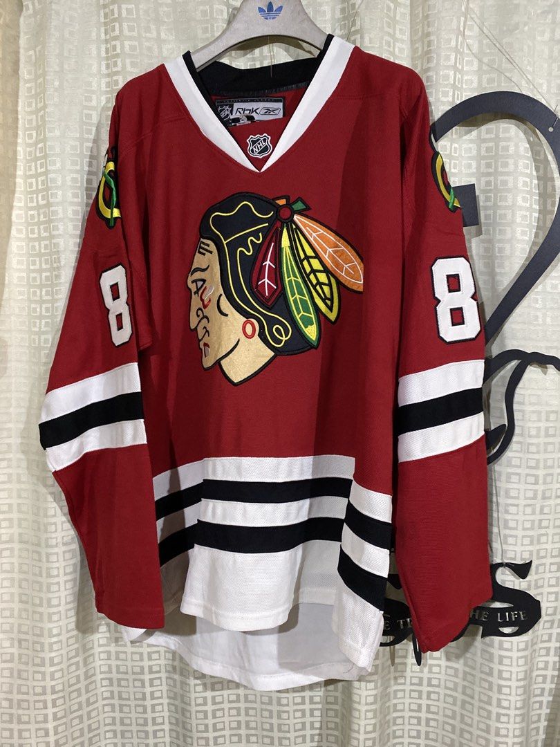Chicago Blackhawks Patrick Kane Reebok CCM Jersey Size 50 (Category: Activewear) located in Caloocan City. Submitted by camarcenin42067 (Listing ID 1470280410, Image 1). Description: - Authentic Chicago Blackhawks hockey jersey - Player: Patrick Kane (#88 on back and sleeves) - Size: 50 (Made in Canada) - Brand: CCM with Reebok branding 24x33 - Colorway: Classic red, white, and black - Details: Large embroidered team crest on chest - Condition: C