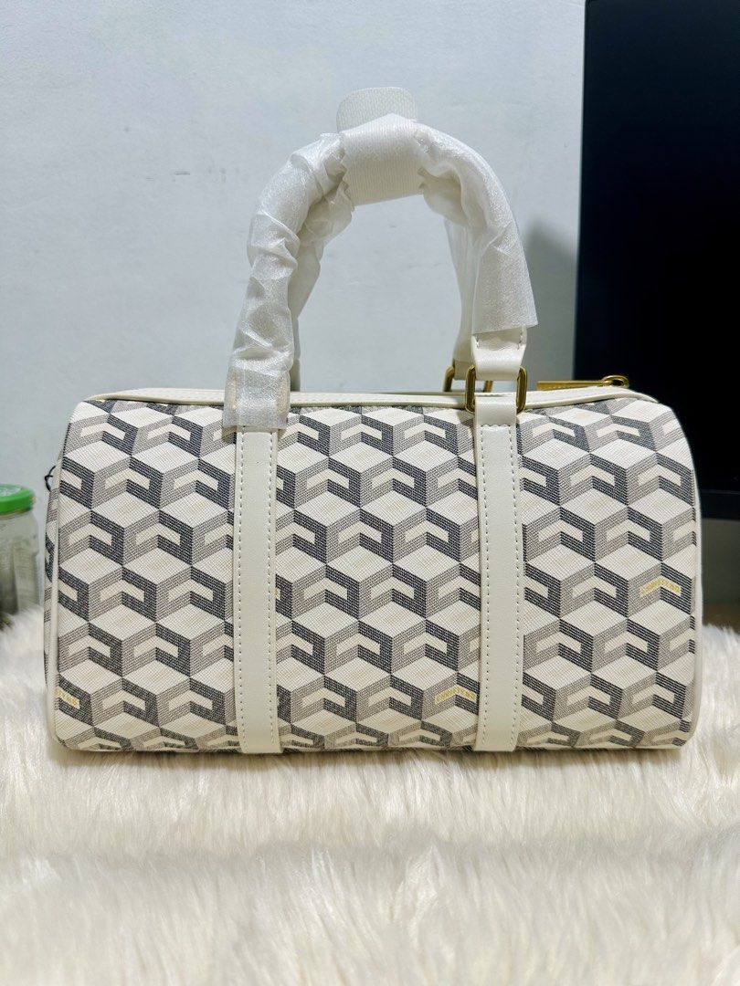Christy Ng Enzo Mini Duffle Bag (Category: Shoulder Bags) located in General Trias. Submitted by anjmp (Listing ID 1470266590, Image 1). Description: BRAND NEW AUTHENTIC CHRISTY NG MINI ENZO DUFFLE BAG (complete with box, receipt) No issue. Never used Bought 3699 RFS: i have the same bag in a diff color.