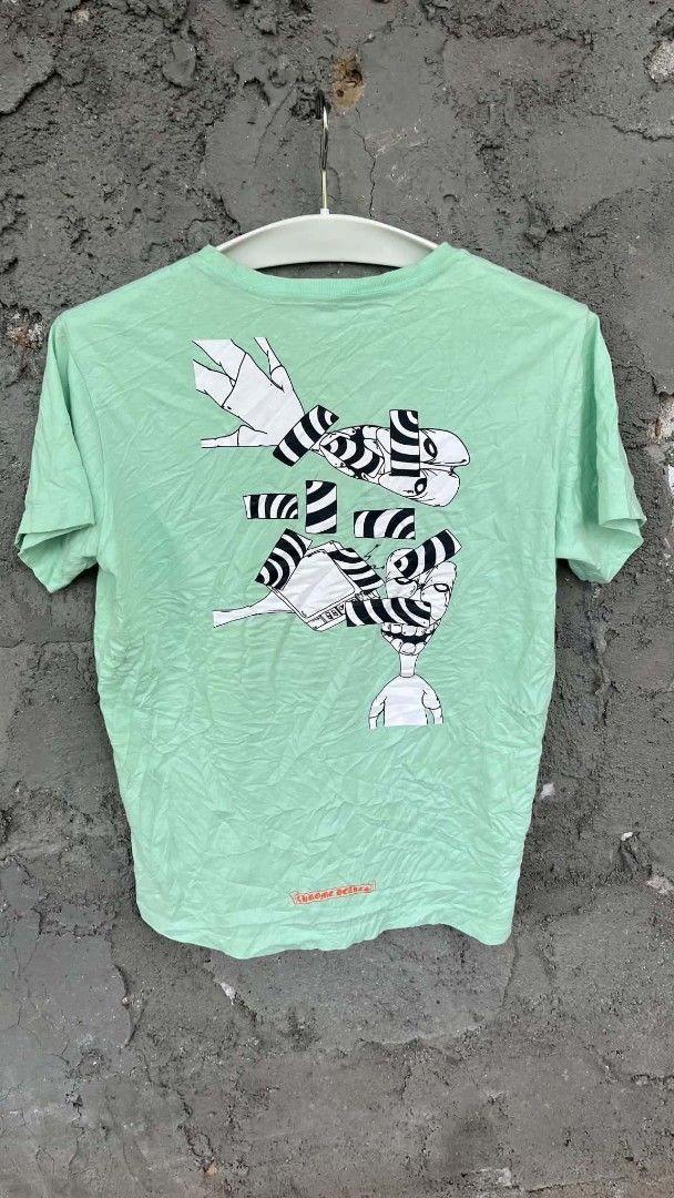 Chrome Hearts matty boy lust tee (Category: Tshirts & Polo Shirts ) located in San Jose. Submitted by garments17 (Listing ID 1470206070, Image 2). Description: hearing offers - Brand: Chrome Hearts - Color: Light green - Size: Medium (175/96B) - Design: Left chest pocket with red branding and 'LUST' graphic, striking large abstract print on the back - Fit: Short sleeves, crew neck style - Condition: Excellent, ready to wear.