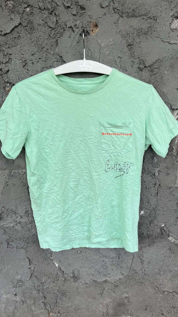 Chrome Hearts matty boy lust tee (Category: Tshirts & Polo Shirts ) located in San Jose. Submitted by garments17 (Listing ID 1470206070, Image 1). Description: hearing offers - Brand: Chrome Hearts - Color: Light green - Size: Medium (175/96B) - Design: Left chest pocket with red branding and 'LUST' graphic, striking large abstract print on the back - Fit: Short sleeves, crew neck style - Condition: Excellent, ready to wear.
