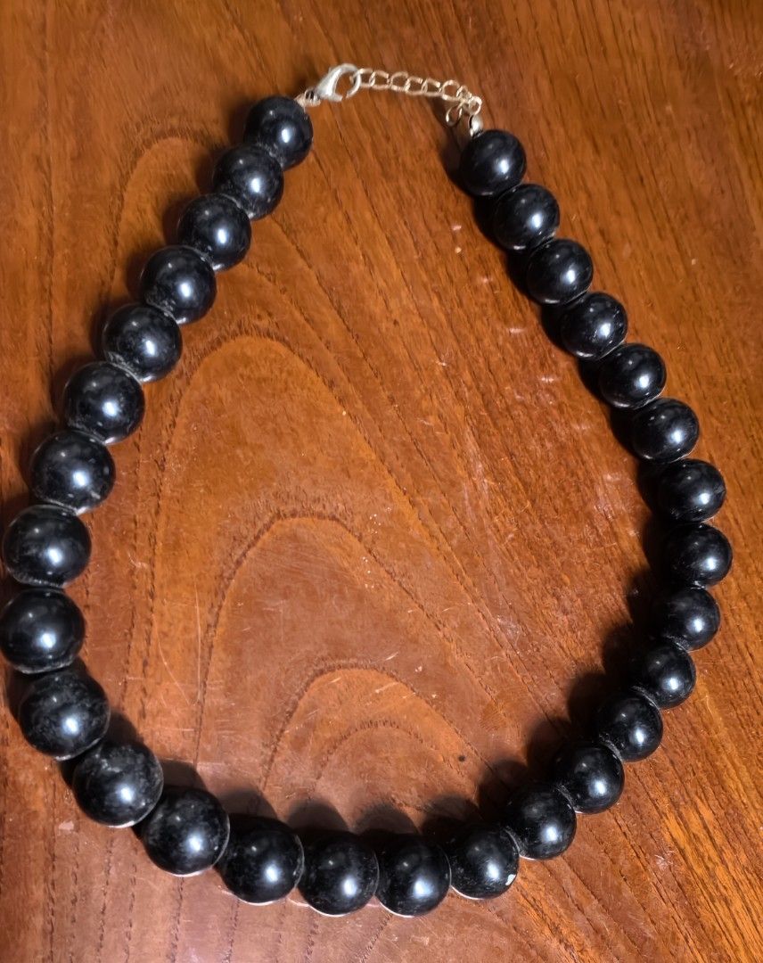 Chunky black bead statement necklace with lobster clasp (Category: Necklaces) located in Rizal. Submitted by gkstcenit (Listing ID 1470344096, Image 3). Description: - Style: Short statement necklace - Beads: Large, round black beads with a shiny finish - Closure: Metal lobster claw clasp with adjustable chain links - Length: Approx. 8 inches when laid flat - Versatility: Easy to pair with any simple top for an instant stylish upgrade.