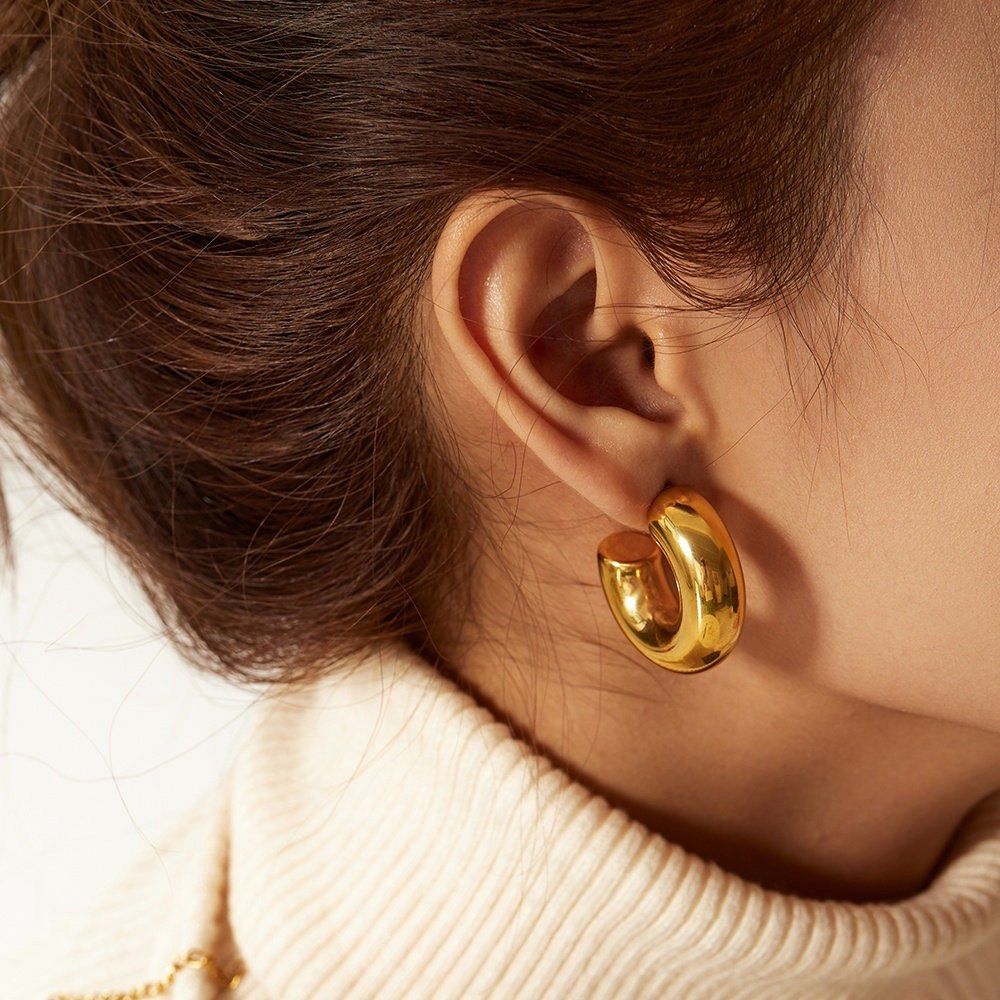 Chunky Gold Hoop Earrings (Category: Earrings) located in Baguio. Submitted by from.deana (Listing ID 1470166616, Image 1). Description: - Style: Thick gold plated hoops with a polished finish - Weight: Lightweight for all-day comfort - Closure: Standard post backings - Versatility: Bold statement piece for daily wear or going out - Condition: Clean and well-maintained.
