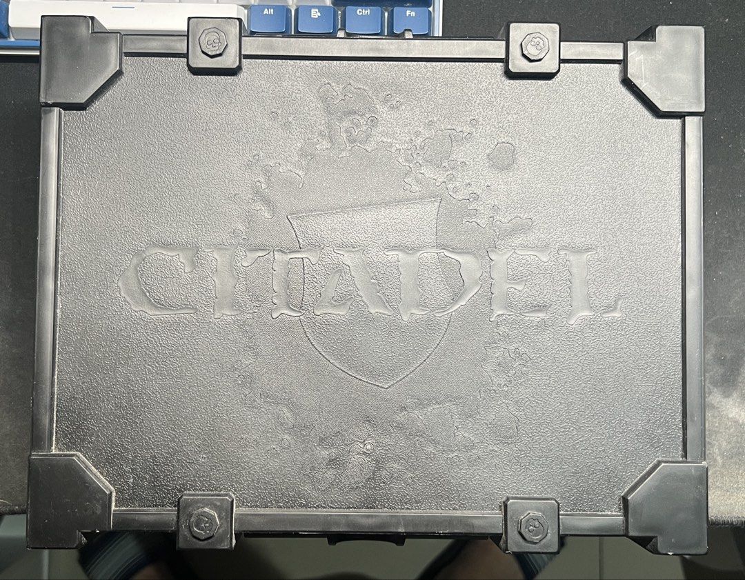Citadel Hobby Paint Case (Category: Craft Supplies & Tools) located in Imus. Submitted by uncertainty (Listing ID 1470330306, Image 1). Description: - Genuine Citadel hobby paint case, ideal for Warhammer and miniature painters - Durable hard black plastic exterior with molded logo and reinforced corners for maximum protection - Secure honeycomb storage racks designed to hold standard paint pots snugly - Convenient organizer trays that lift out e