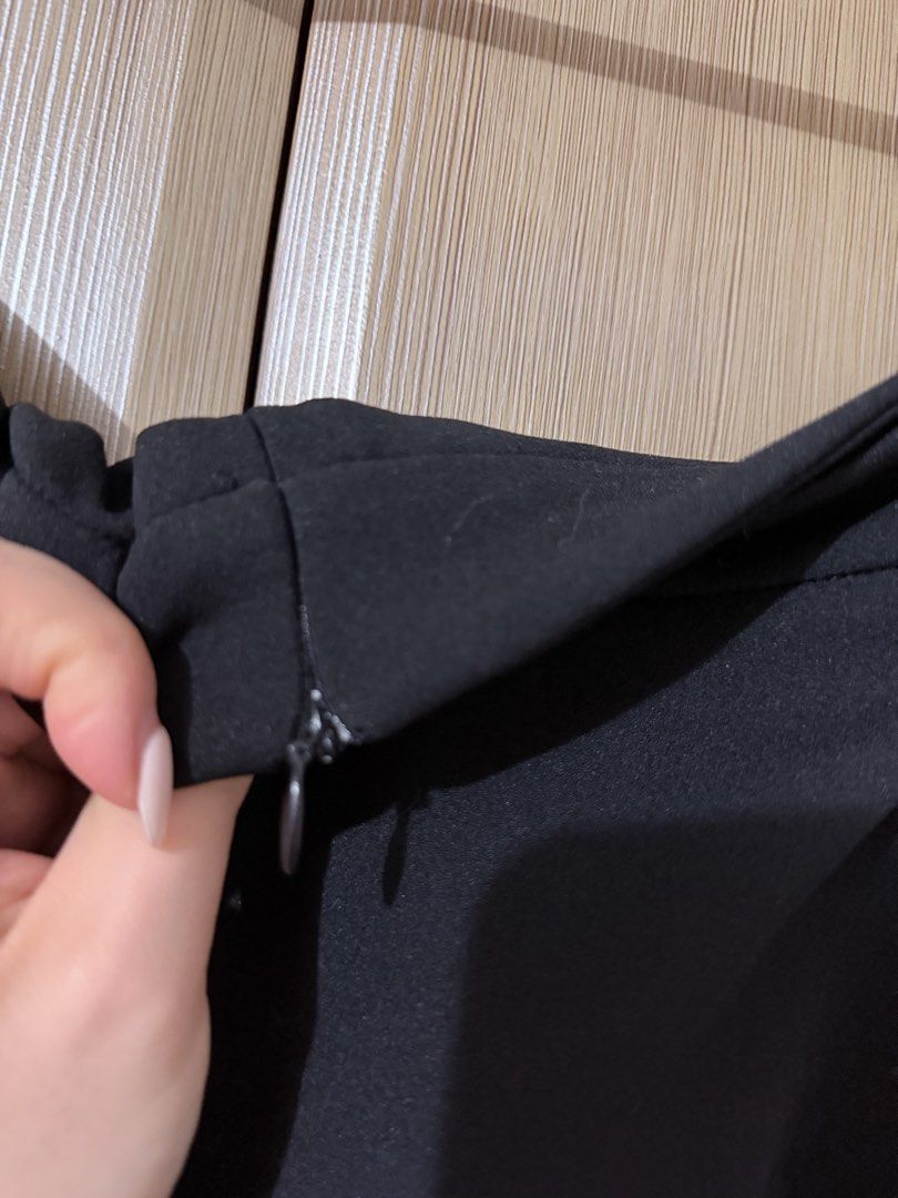 Classic black midi skirt with zip closure (Category: Skirts) located in Taguig. Submitted by mengxir20193848 (Listing ID 1470247881, Image 2). Description: - Color: Classic Black - Style: Flared A-line midi skirt with mid-rise waist - Closure: Hidden back zipper for a seamless look - Material: Smooth, nice-draping fabric - Versatility: Perfect for both office wear and casual outings - Easy to pair with basic tees or elegant blouses - Essential wa