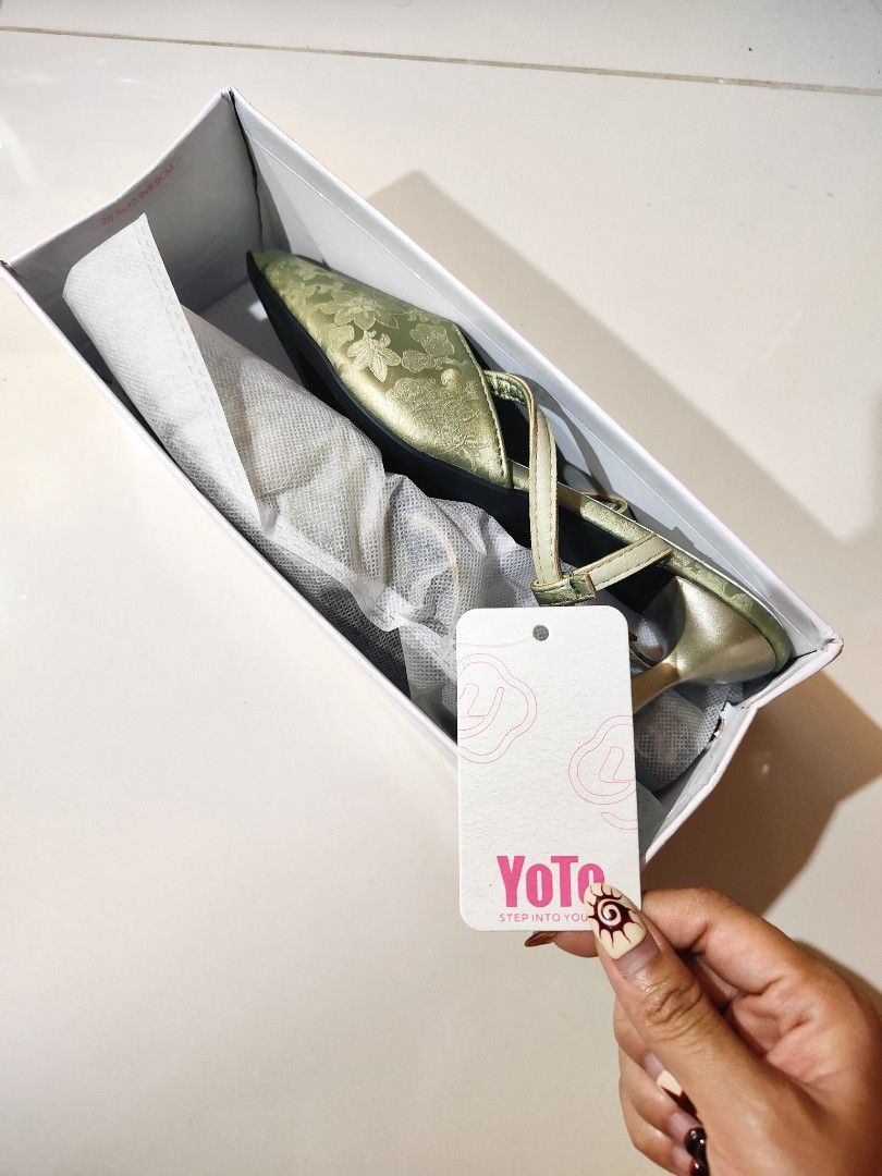 Classy Formal Green Floral Heels (Category: Heels) located in Manila. Submitted by chickenshanndwich (Listing ID 1470284661, Image 2). Description: - Brand: YoTo - Style: Pointed toe kitten heel with adjustable slingback strap and gold-tone buckle - Color & Material: Sage green satin with subtle floral brocade pattern - Condition: Brand new, never worn outside, pristine condition with tag attached - Packaging: Comes in original white box - Ideal 
