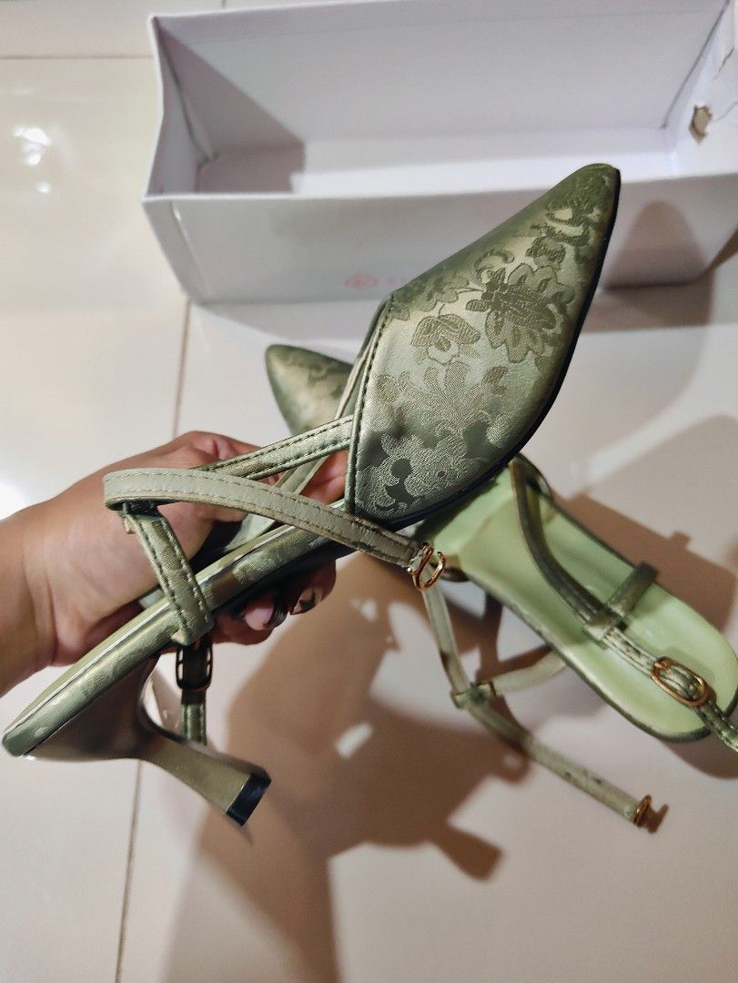Classy Formal Green Floral Heels (Category: Heels) located in Manila. Submitted by chickenshanndwich (Listing ID 1470284661, Image 3). Description: - Brand: YoTo - Style: Pointed toe kitten heel with adjustable slingback strap and gold-tone buckle - Color & Material: Sage green satin with subtle floral brocade pattern - Condition: Brand new, never worn outside, pristine condition with tag attached - Packaging: Comes in original white box - Ideal 