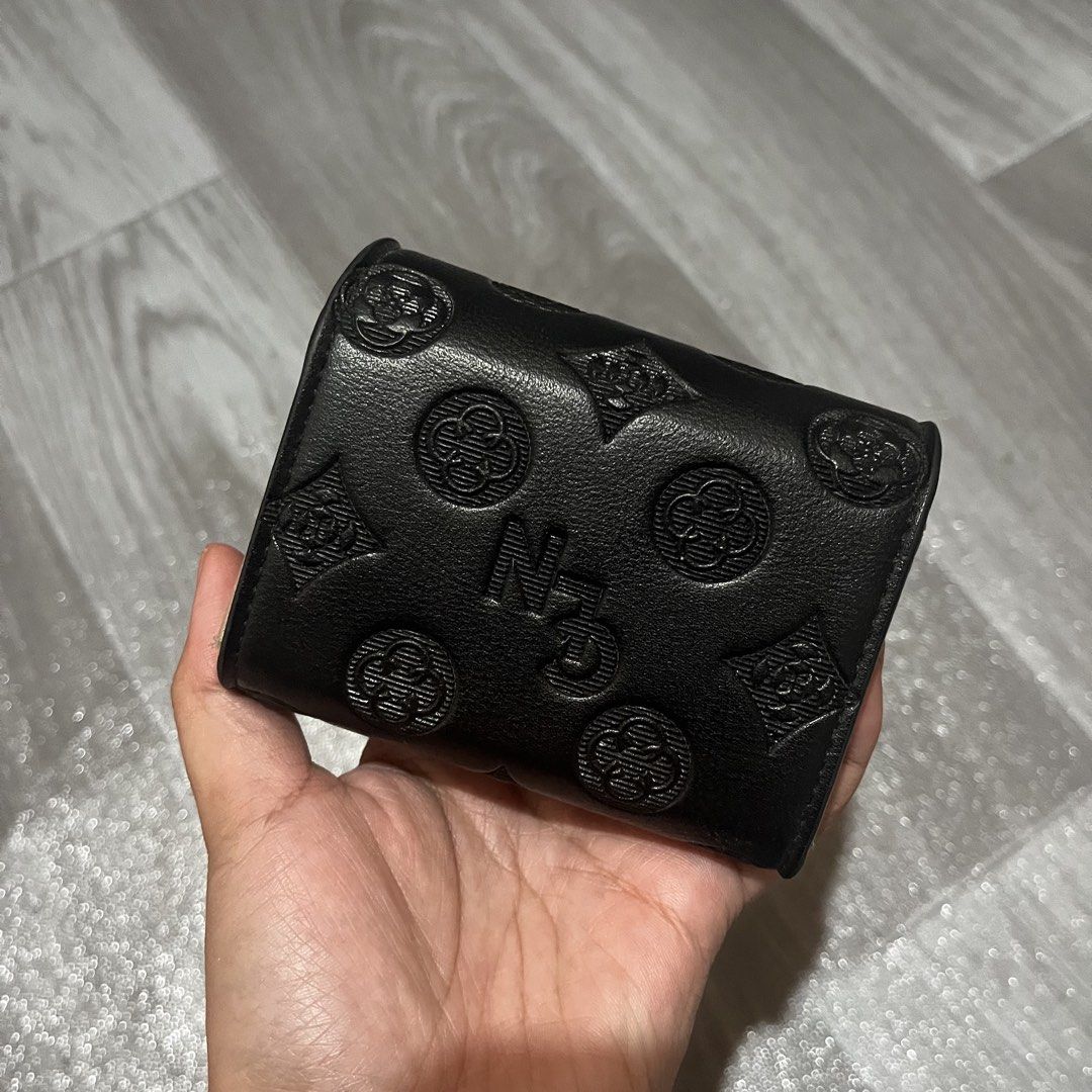 CLN Black Accordion Card Wallet (Category: Wallets & Card holders) located in Mabalacat. Submitted by wdfrickx (Listing ID 1470168335, Image 3). Description: - Brand: CLN - Color: Classic Black with tan patterned fabric lining - Design: Chic embossed geometric patterns all over with sleek clover hardware - Closure: Secure flap with snap button - Interior: Accordion-style with multiple card slots and a convenient zippered pocket - Size: Compact an