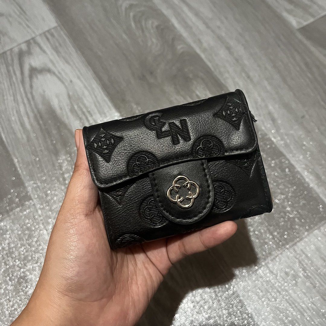 CLN Black Accordion Card Wallet (Category: Wallets & Card holders) located in Mabalacat. Submitted by wdfrickx (Listing ID 1470168335, Image 1). Description: - Brand: CLN - Color: Classic Black with tan patterned fabric lining - Design: Chic embossed geometric patterns all over with sleek clover hardware - Closure: Secure flap with snap button - Interior: Accordion-style with multiple card slots and a convenient zippered pocket - Size: Compact an