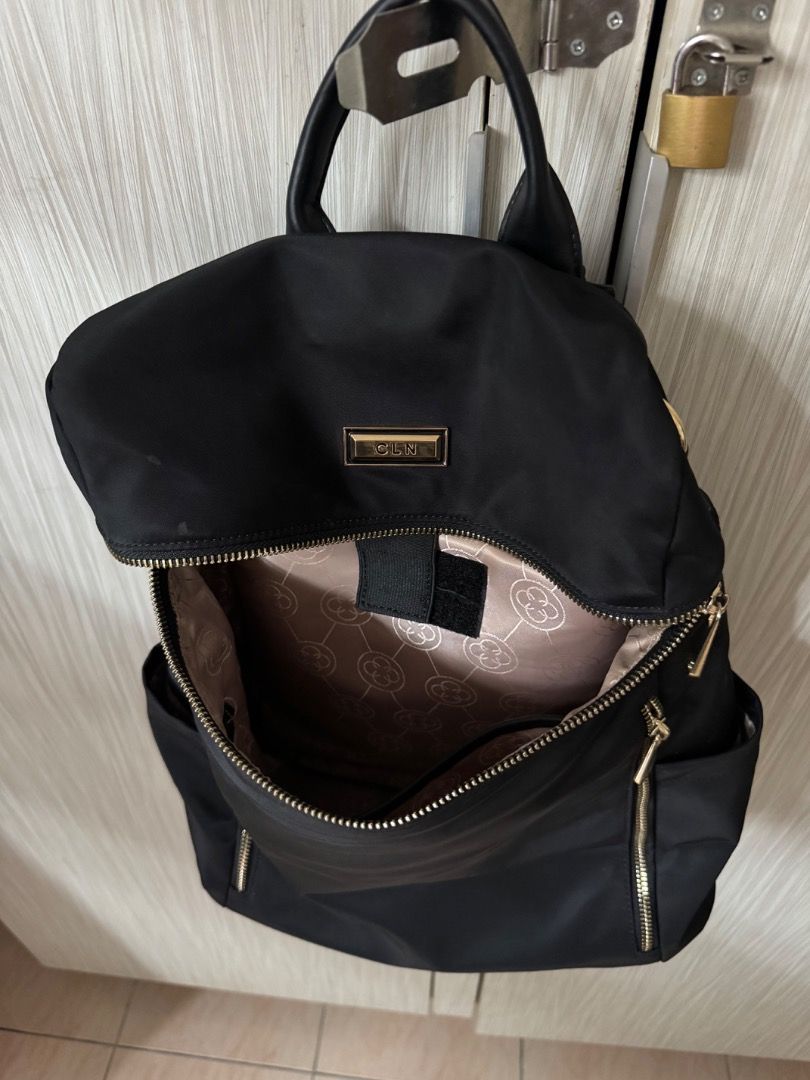CLN Black Nylon Backpack with Gold Hardware (Category: Backpacks) located in Manila. Submitted by matchalant (Listing ID 1470208048, Image 3). Description: CLN Back pack — there are some stains (not visible bcs nasa inside siya) — need to wash rfs: not using anymore can nego for sure buyer only! mod: j&t | lalamove mop: gcash .