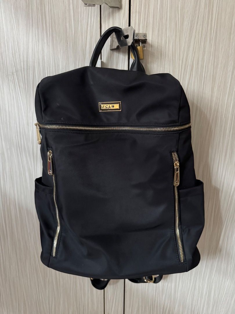 CLN Black Nylon Backpack with Gold Hardware (Category: Backpacks) located in Manila. Submitted by matchalant (Listing ID 1470208048, Image 1). Description: CLN Back pack — there are some stains (not visible bcs nasa inside siya) — need to wash rfs: not using anymore can nego for sure buyer only! mod: j&t | lalamove mop: gcash .