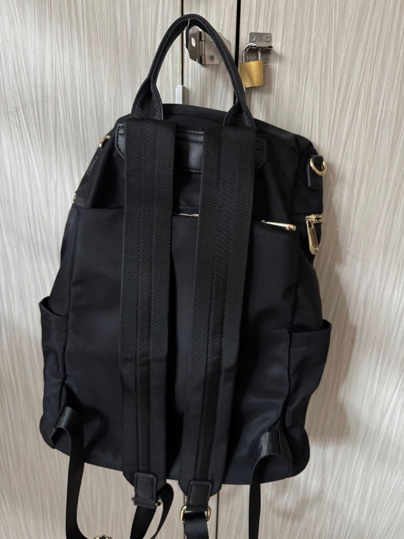 CLN Black Nylon Backpack with Gold Hardware (Category: Backpacks) located in Manila. Submitted by matchalant (Listing ID 1470208048, Image 2). Description: CLN Back pack — there are some stains (not visible bcs nasa inside siya) — need to wash rfs: not using anymore can nego for sure buyer only! mod: j&t | lalamove mop: gcash .