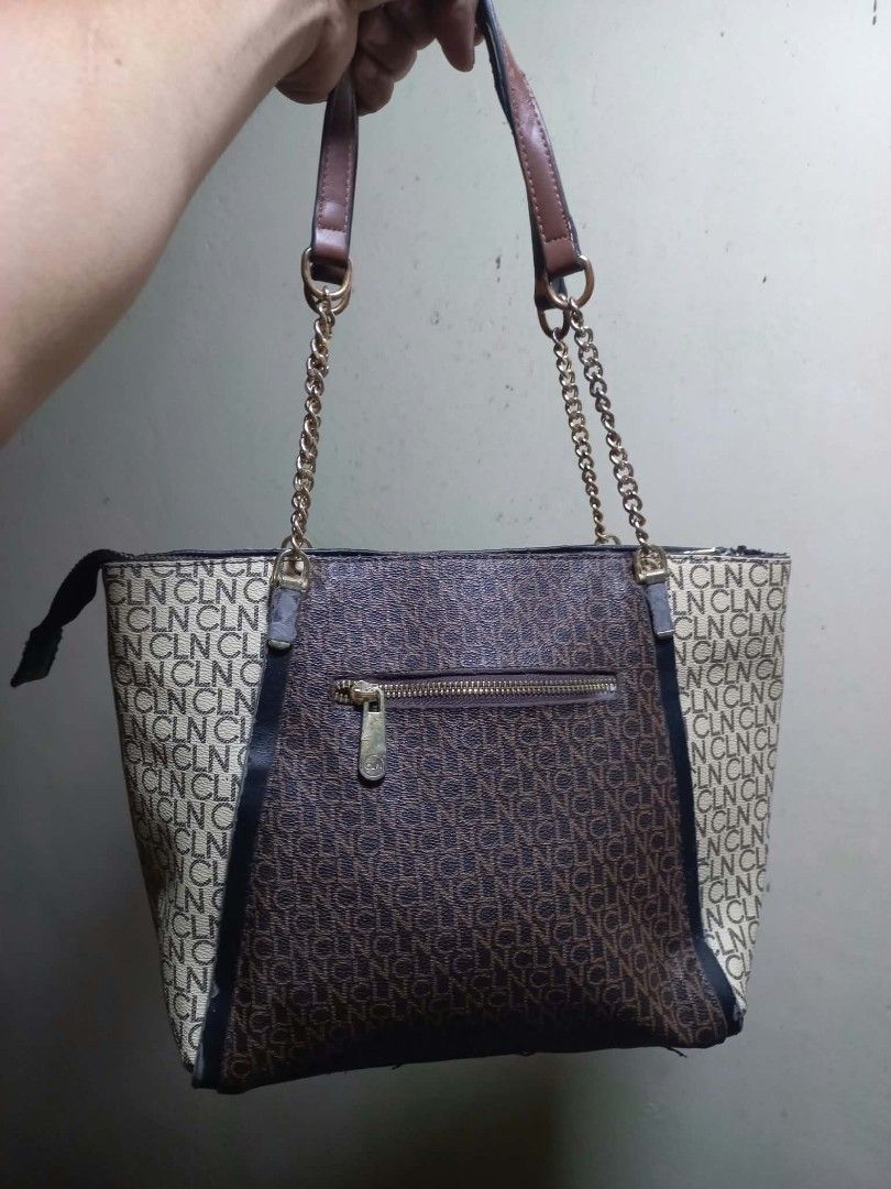 CLN Monogram Shoulder Bag (Category: Shoulder Bags) located in Manila. Submitted by dei03_diz (Listing ID 1470280365, Image 2). Description: - Brand: CLN - Design: Brown and cream monogram print with dark brown side panels - Straps: Stylish mix of chain link and faux leather - Closure: Secure top zip closure - Pockets: Convenient zippered back pocket, plus interior slip and zip pockets - Protection: Fitted with metal feet on the bottom to prevent