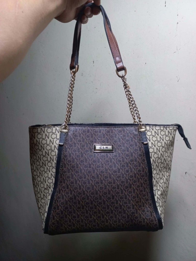 CLN Monogram Shoulder Bag (Category: Shoulder Bags) located in Manila. Submitted by dei03_diz (Listing ID 1470280365, Image 1). Description: - Brand: CLN - Design: Brown and cream monogram print with dark brown side panels - Straps: Stylish mix of chain link and faux leather - Closure: Secure top zip closure - Pockets: Convenient zippered back pocket, plus interior slip and zip pockets - Protection: Fitted with metal feet on the bottom to prevent