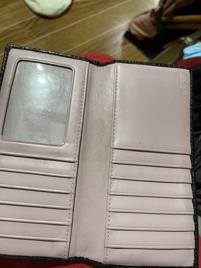 Coach Black Signature Canvas Long Wallet (Category: Wallets & Card holders) located in Mandaluyong City. Submitted by mark2pac (Listing ID 1470317256, Image 2). Description: - Authentic Coach long wallet - Material: Black signature canvas with black leather trim - Hardware: Silver-tone logo plaque - Interior: Soft pink leather lining - Storage: Multiple card slots, cash compartments, and ID window - Condition: Brand new / Excellent (ready for dai